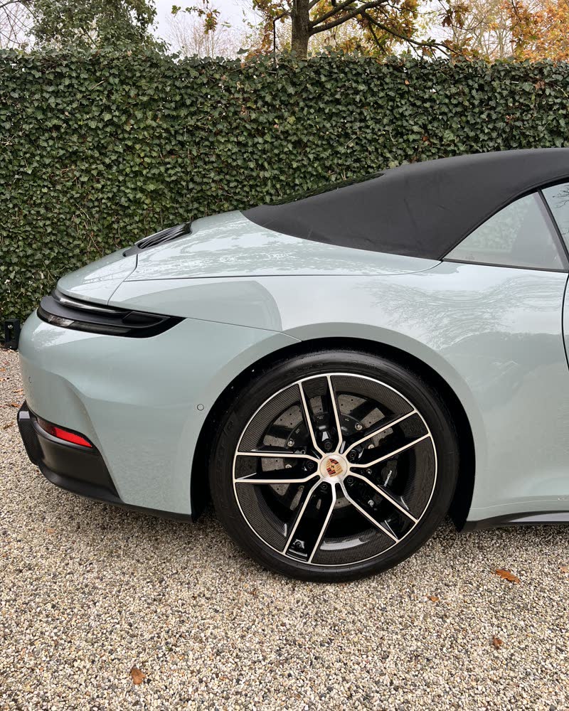 A Porsche detailed on a private driveway.