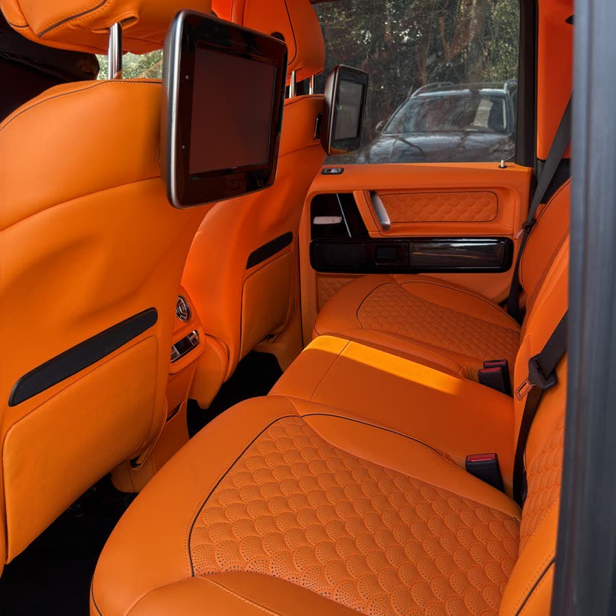 Orange leather rear seats after a full interior detail.